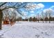 Snowy yard featuring mature trees in a serene setting at 1307 W 161St St, Westfield, IN 46074