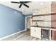 Finished basement featuring a bar area with stone accents, and shelving, perfect for entertaining at 1324 Trailside Dr, Greenwood, IN 46143