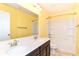 Bright bathroom with double sinks, a large mirror, and a shower-tub combination at 1324 Trailside Dr, Greenwood, IN 46143