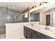 Sleek bathroom featuring a glass shower enclosure, double vanity, and modern fixtures at 1324 Trailside Dr, Greenwood, IN 46143