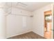 Cozy bedroom with carpet, shelving, and a view to the ensuite bathroom at 1324 Trailside Dr, Greenwood, IN 46143