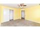 Bedroom featuring neutral carpet, white walls, and a ceiling fan with light fixture at 1324 Trailside Dr, Greenwood, IN 46143