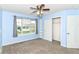 Bedroom featuring neutral carpet, one window and a ceiling fan with light fixture and a closet at 1324 Trailside Dr, Greenwood, IN 46143