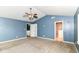 Cozy bedroom featuring plush carpet, and entry to an ensuite bathroom at 1324 Trailside Dr, Greenwood, IN 46143