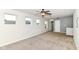 Bright, carpeted bedroom with natural light, ceiling fan, and neutral-colored walls at 1324 Trailside Dr, Greenwood, IN 46143