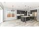 Stylish kitchen with a large island, stainless steel appliances, pendant lighting and hardwood floors at 1324 Trailside Dr, Greenwood, IN 46143