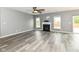 Spacious living room features hardwood floors, a modern fireplace and two windows for ample natural light at 1324 Trailside Dr, Greenwood, IN 46143