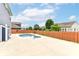 Backyard pool area perfect for relaxing or entertaining with a fence for privacy at 1324 Trailside Dr, Greenwood, IN 46143