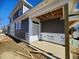 New construction home exterior, showcasing modern design and gray siding at 196 Northwalk Cir, Westfield, IN 46074