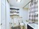 Clean bathroom with fresh white fixtures and a shower-tub combo at 2414 W 16Th St, Anderson, IN 46016
