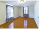 Sunlit bedroom with hardwood floors and simple decor at 2414 W 16Th St, Anderson, IN 46016