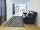 Comfortable living area with stylish rug and cozy seating arrangement at 2414 W 16Th St, Anderson, IN 46016