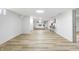 Finished basement with light wood flooring, white walls, and a cozy sitting area at 3052 S Fielding Rd, New Palestine, IN 46163