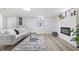 Bright basement sitting area featuring a fireplace and comfortable seating at 3052 S Fielding Rd, New Palestine, IN 46163