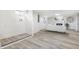 Finished basement with light wood flooring, white walls, and a fireplace at 3052 S Fielding Rd, New Palestine, IN 46163
