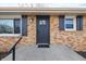 Brick ranch house with a gray front door and black shutters at 3052 S Fielding Rd, New Palestine, IN 46163