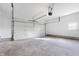 Unfinished garage with a white door and a concrete floor at 3052 S Fielding Rd, New Palestine, IN 46163