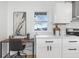 Kitchen workstation with white cabinets and marble countertops at 3052 S Fielding Rd, New Palestine, IN 46163