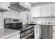Modern kitchen features stainless steel appliances and white shaker cabinets at 3052 S Fielding Rd, New Palestine, IN 46163
