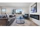 Bright living room featuring hardwood floors, fireplace, and comfy seating at 3052 S Fielding Rd, New Palestine, IN 46163