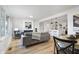 Open living space with hardwood floors, fireplace, and kitchen view at 3052 S Fielding Rd, New Palestine, IN 46163
