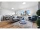 Light-filled living area with hardwood floors and a cozy seating arrangement at 3052 S Fielding Rd, New Palestine, IN 46163