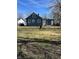 A spacious backyard featuring lawn and direct access to the home's side and back entrances at 310 S Gerrard Dr, Indianapolis, IN 46241