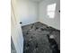 Cozy bedroom with modern black and gray carpet and a window for natural light at 310 S Gerrard Dr, Indianapolis, IN 46241