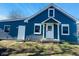 Charming blue two-story home with white trim and a covered front porch at 310 S Gerrard Dr, Indianapolis, IN 46241