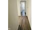 Hallway with neutral walls and wood flooring at 310 S Gerrard Dr, Indianapolis, IN 46241