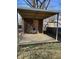 Backyard outbuilding featuring wood structure, concrete footings, and partial walls at 310 S Gerrard Dr, Indianapolis, IN 46241