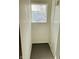 Small storage nook with tiled floor and window for light at 310 S Gerrard Dr, Indianapolis, IN 46241