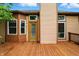 Spacious wooden back deck, perfect for outdoor entertaining, with multiple windows and exterior lighting at 4646 Rocky Knob Ln, Indianapolis, IN 46254