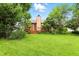 Expansive backyard featuring a wooden deck and mature trees, perfect for outdoor enjoyment at 4646 Rocky Knob Ln, Indianapolis, IN 46254