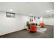 Basement area featuring a comfortable seating arrangement with natural light from a window at 4646 Rocky Knob Ln, Indianapolis, IN 46254