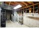 Unfinished basement with concrete floor, open ceiling, and visible utilities at 4646 Rocky Knob Ln, Indianapolis, IN 46254