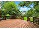 Wooden deck overlooking a spacious backyard with lush green grass at 4646 Rocky Knob Ln, Indianapolis, IN 46254