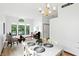 Sunlit dining area features large windows, traditional chandelier and space for entertaining at 4646 Rocky Knob Ln, Indianapolis, IN 46254