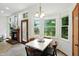 A combined kitchen-dining area featuring a traditional fireplace and a bay window at 4646 Rocky Knob Ln, Indianapolis, IN 46254