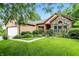 Charming home exterior with brick and siding, plus a well-manicured lawn and landscaping at 4646 Rocky Knob Ln, Indianapolis, IN 46254