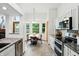 Eat-in kitchen with stainless appliances, granite counters, tile floors and large bay window at 4646 Rocky Knob Ln, Indianapolis, IN 46254