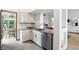 This updated kitchen area features granite counters, white cabinets, and stainless steel appliances at 4646 Rocky Knob Ln, Indianapolis, IN 46254