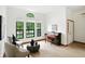 Elegant living room featuring neutral-toned furniture, hardwood floors, and a piano at 4646 Rocky Knob Ln, Indianapolis, IN 46254