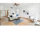 Bright, spacious living room features a modern sofa, plush accent chair, and minimalist decor at 4646 Rocky Knob Ln, Indianapolis, IN 46254