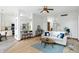 Bright living room with open floor plan, wood floors, and access to the kitchen at 4646 Rocky Knob Ln, Indianapolis, IN 46254