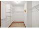 Walk-in closet with wire shelving and hardwood floors, providing ample storage space at 4646 Rocky Knob Ln, Indianapolis, IN 46254