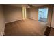 Spacious living room with neutral walls and carpet at 5209 Laredo St, Indianapolis, IN 46237