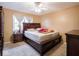 Bedroom with double bed, ceiling fan, and wood furniture at 6004 S Orinoco Ave, Indianapolis, IN 46227