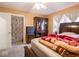 Bedroom with double bed, ceiling fan, and ample storage at 6004 S Orinoco Ave, Indianapolis, IN 46227