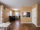 Cozy dining area with hardwood floors and a table for four at 6004 S Orinoco Ave, Indianapolis, IN 46227